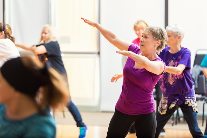 baby boomer women taking a zumba dance class to stay healthy